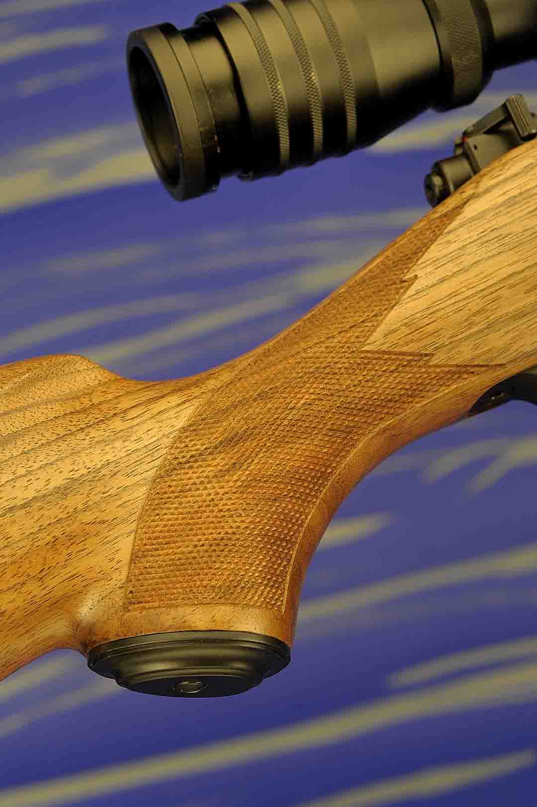 Fine line checking in a 20 lines-per-inch point pattern is standard on the model. More than an adequate design has been applied to both the pistol grip and forearm of the rifle. The metal grip also complements this part of the rifle.
